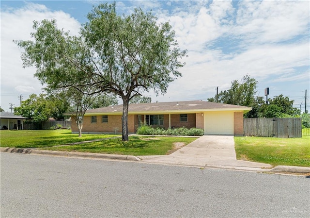 206 E Ricky Crossland Ave, Elsa, TX 78543 - ranch-style house featuring brick siding, driveway, and a garage