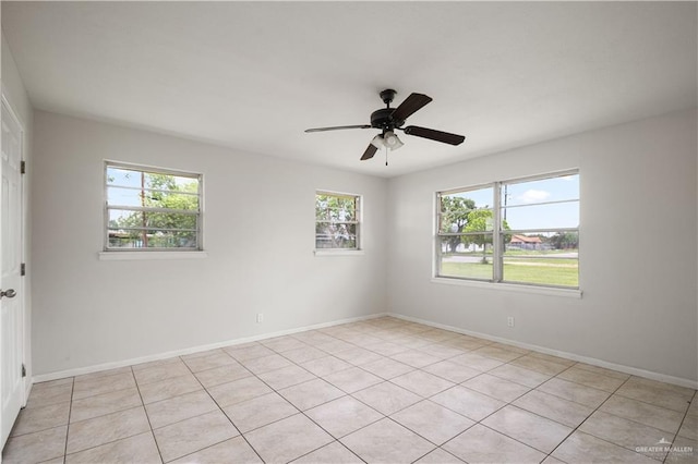 206 E Ricky Crossland Ave, Elsa, TX 78543 - unfurnished room featuring healthy amount of natural light, ceiling fan, and light tile patterned flooring