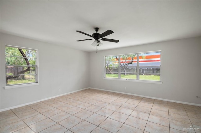 206 E Ricky Crossland Ave, Elsa, TX 78543 - spare room featuring plenty of natural light, light tile patterned floors, and ceiling fan
