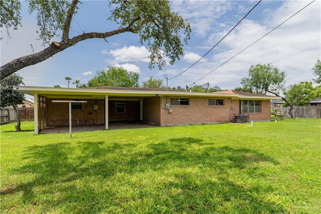 206 E Ricky Crossland Ave, Elsa, TX 78543 - rear view of property with brick siding and a carport