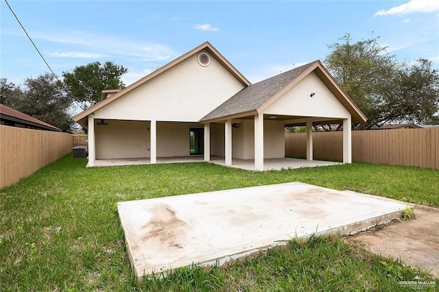 back of house with a lawn, a fenced backyard, a patio area, and cooling unit