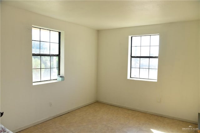 unfurnished room featuring a healthy amount of sunlight