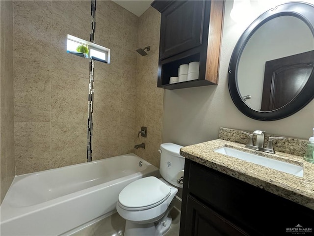 full bathroom with vanity, toilet, and tiled shower / bath