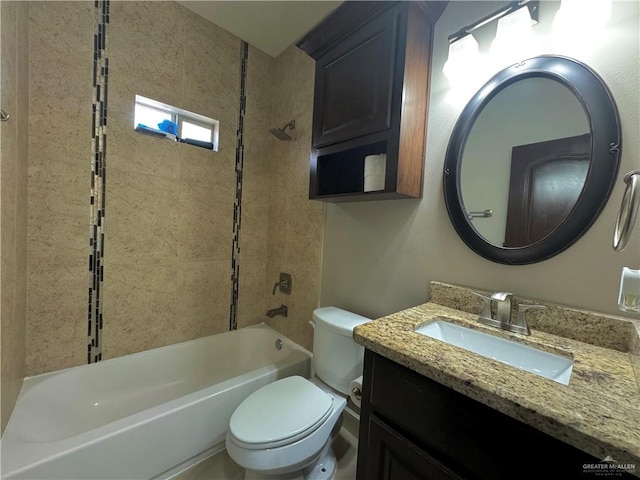 full bathroom with vanity, toilet, and tiled shower / bath combo