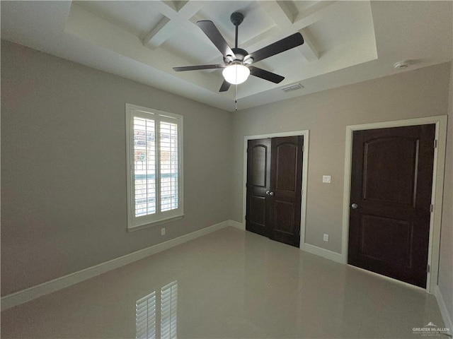 unfurnished bedroom featuring beamed ceiling, ceiling fan, and coffered ceiling