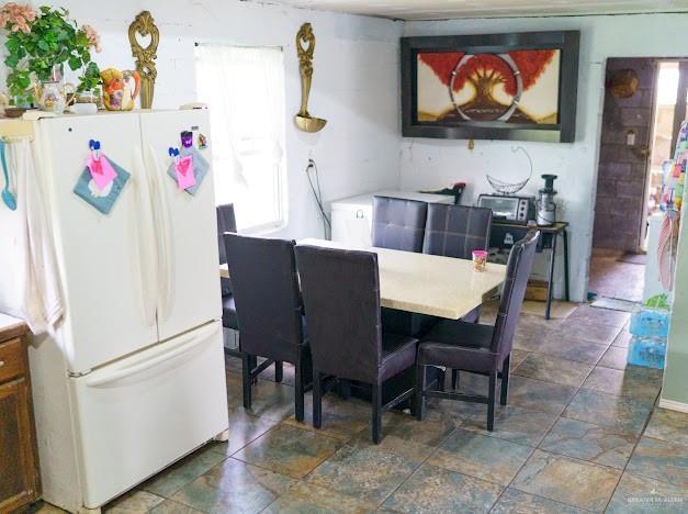 4011 Pepe Dr, Mission, TX 78574 - dining room featuring dark stone finish floors