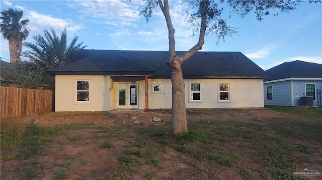 rear view of house featuring french doors and central AC unit