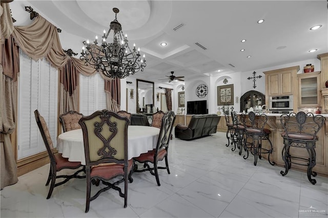 dining area with ceiling fan with notable chandelier, beam ceiling, and coffered ceiling