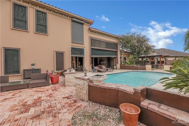 view of pool featuring a patio