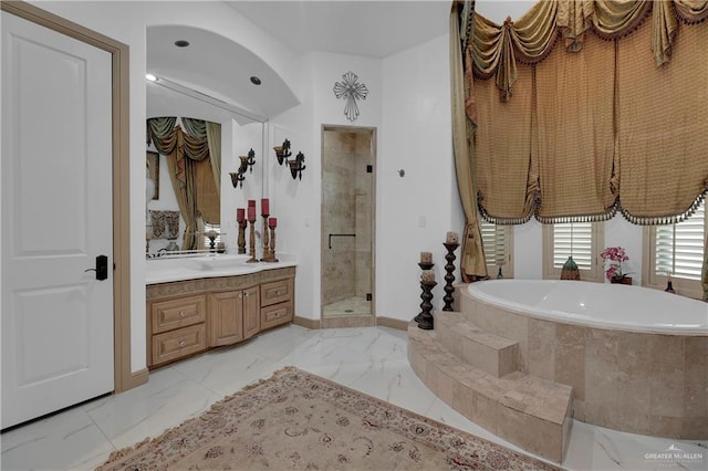 bathroom featuring vanity and plus walk in shower