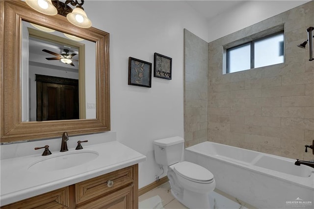 full bathroom featuring tile patterned floors, vanity, tiled shower / bath combo, ceiling fan, and toilet