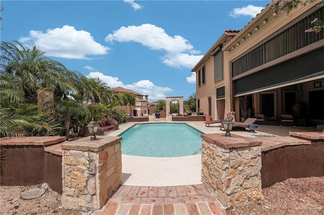 view of swimming pool featuring a patio area