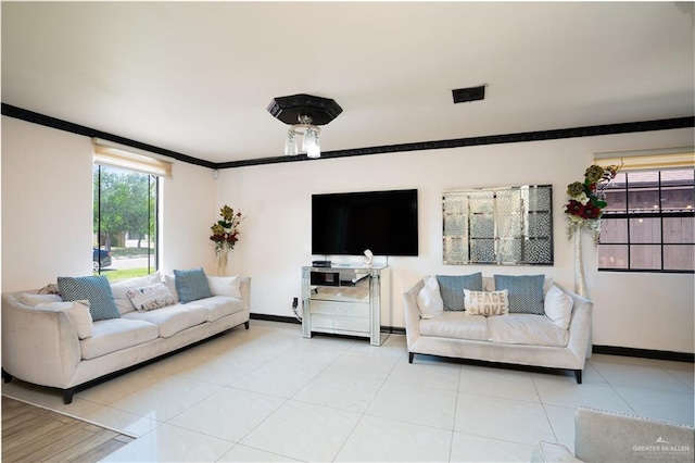 tiled living room featuring crown molding