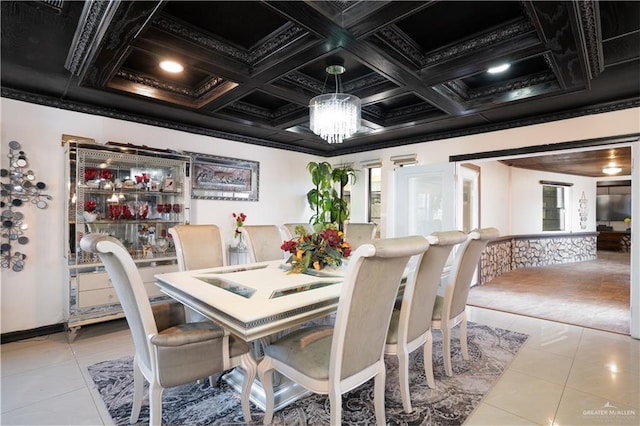 tiled dining space with plenty of natural light, a chandelier, and coffered ceiling