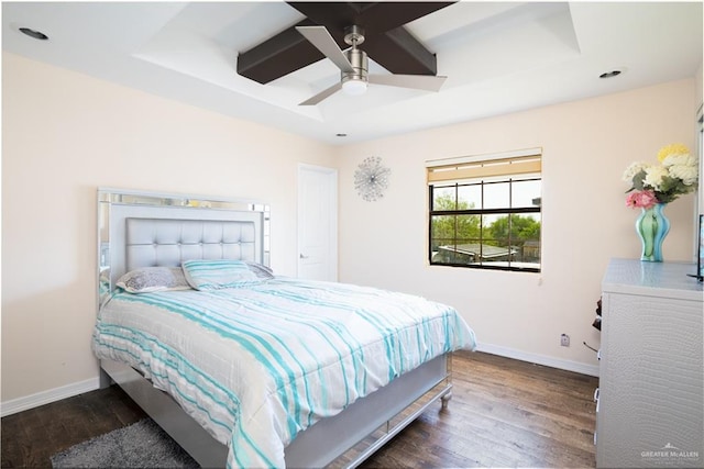 bedroom with beam ceiling, dark hardwood / wood-style floors, and ceiling fan