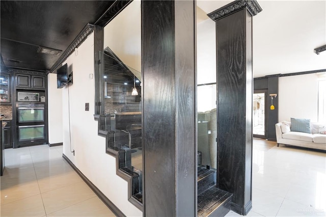 corridor featuring light tile patterned flooring