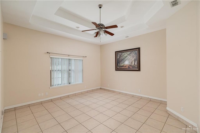 3512 W Gardenia Ave, Mcallen, TX 78501 - empty room with visible vents, a ceiling fan, light tile patterned flooring, and a tray ceiling