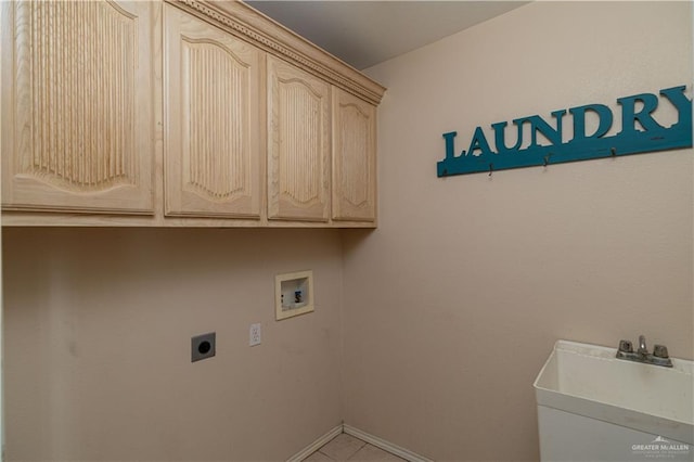 3512 W Gardenia Ave, Mcallen, TX 78501 - laundry room featuring hookup for a washing machine, cabinet space, hookup for an electric dryer, a sink, and baseboards