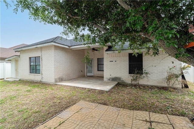 3512 W Gardenia Ave, Mcallen, TX 78501 - back of property with a patio, brick siding, fence, and a yard