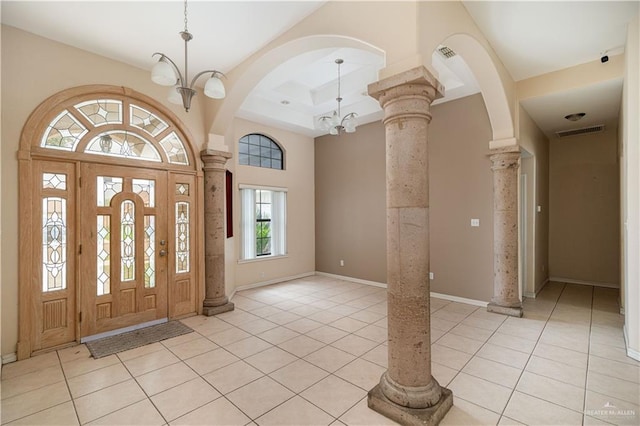 3512 W Gardenia Ave, Mcallen, TX 78501 - foyer entrance with light tile patterned floors, visible vents, and decorative columns