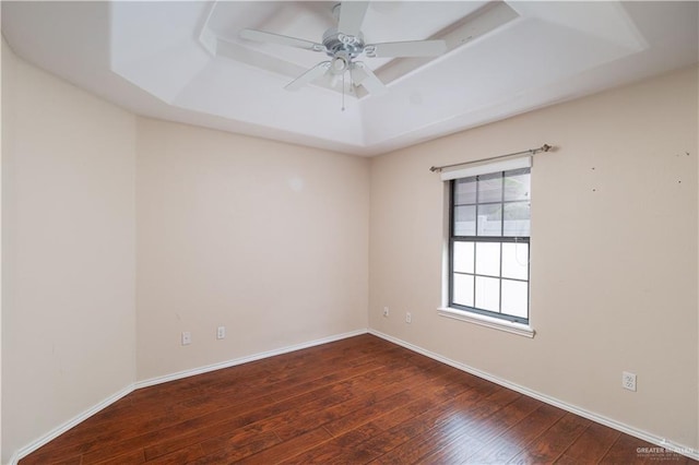 3512 W Gardenia Ave, Mcallen, TX 78501 - unfurnished room with baseboards, a raised ceiling, ceiling fan, and wood-type flooring