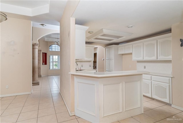 3512 W Gardenia Ave, Mcallen, TX 78501 - kitchen with light tile patterned flooring, arched walkways, and white cabinets