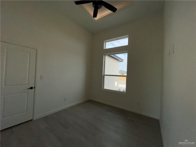 unfurnished room featuring ceiling fan and dark hardwood / wood-style floors