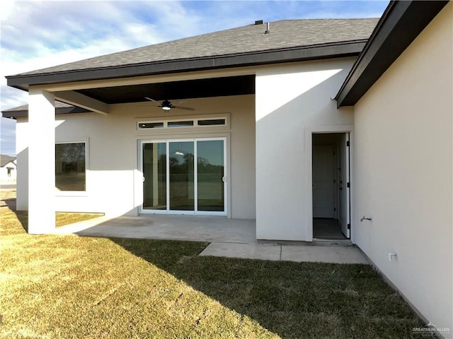 back of house featuring a yard, a patio, and ceiling fan