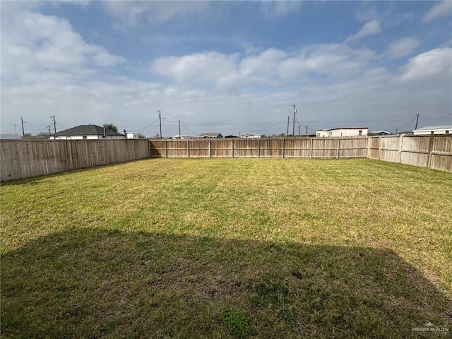 view of yard featuring a fenced backyard