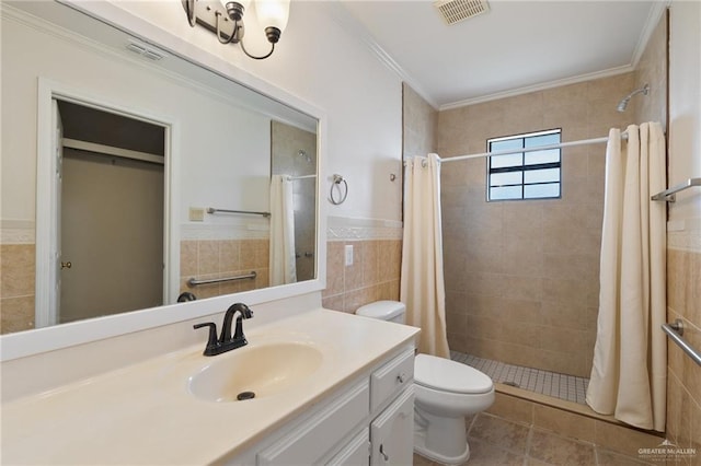 bathroom featuring walk in shower, ornamental molding, vanity, tile walls, and toilet