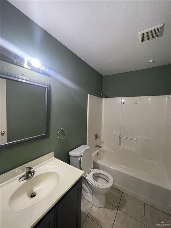 full bathroom with tile patterned floors, vanity, shower / bathtub combination, and toilet