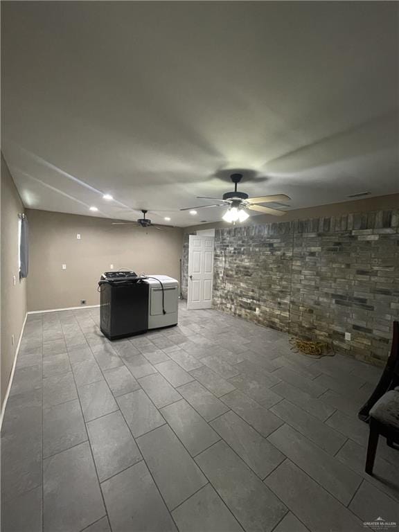 unfurnished living room featuring ceiling fan