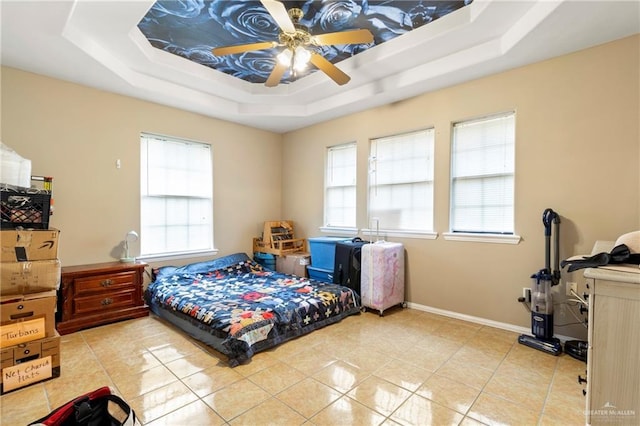 1123 E Champion St, Edinburg, TX 78539 - bedroom featuring a raised ceiling, multiple windows, and light tile patterned flooring