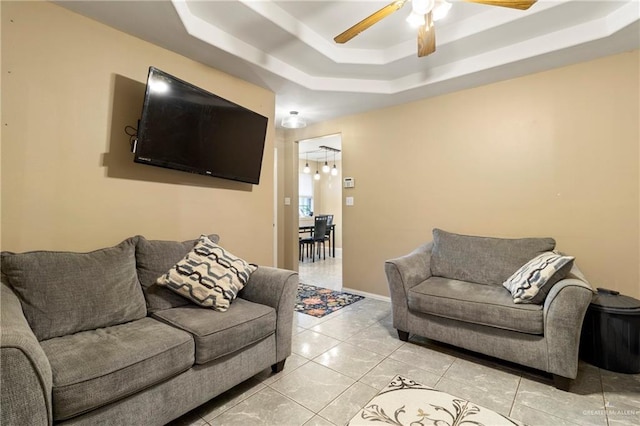 1123 E Champion St, Edinburg, TX 78539 - living room with a tray ceiling, ceiling fan, and light tile patterned floors