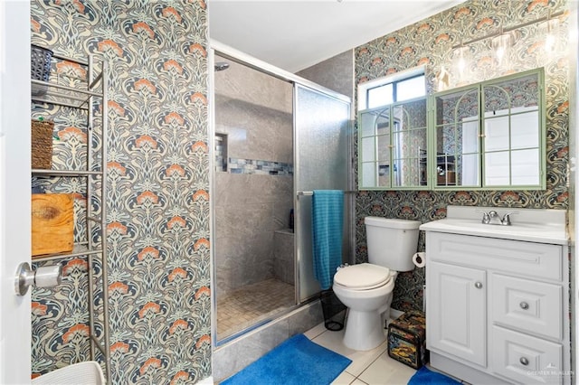 1123 E Champion St, Edinburg, TX 78539 - bathroom with toilet, vanity, a shower stall, tile patterned flooring, and wallpapered walls