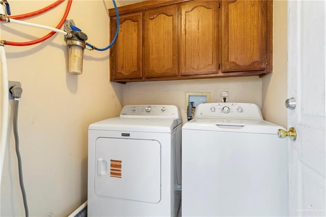 1123 E Champion St, Edinburg, TX 78539 - laundry area featuring cabinet space and separate washer and dryer