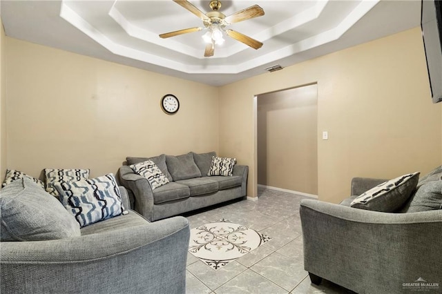 1123 E Champion St, Edinburg, TX 78539 - living room featuring a tray ceiling, ceiling fan, and light tile patterned floors