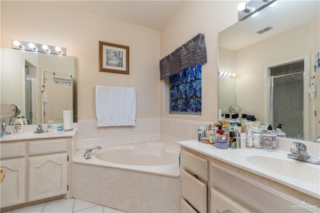 bathroom featuring tile patterned flooring, vanity, and separate shower and tub