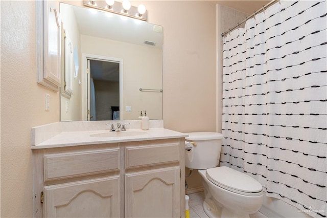 full bathroom featuring tile patterned flooring, vanity, toilet, and shower / bathtub combination with curtain