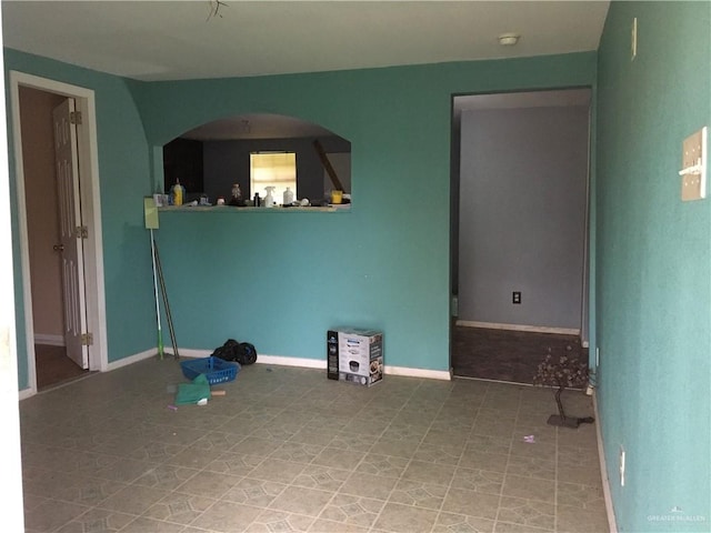 empty room with tile patterned flooring