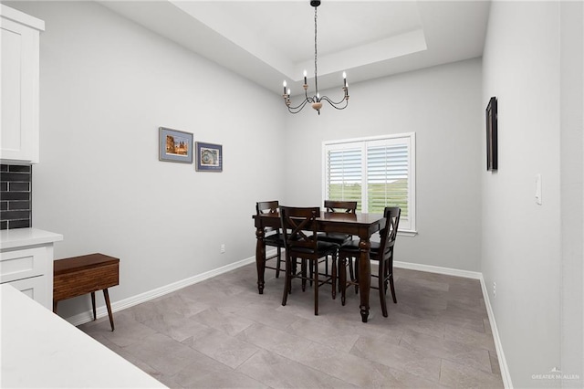 2413 S Cartier Dr, Edinburg, TX 78542 - dining area with a chandelier and a raised ceiling