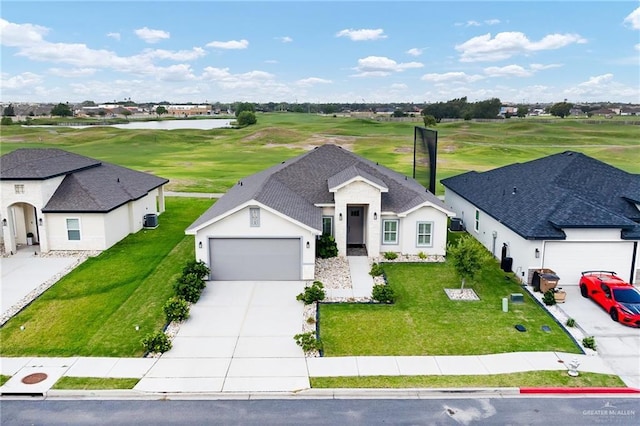 2413 S Cartier Dr, Edinburg, TX 78542 - view of front of home with concrete driveway, golf course view, stucco siding, an attached garage, and a front yard