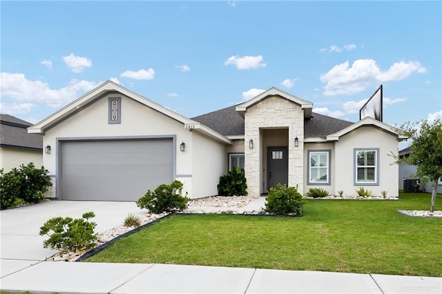 2413 S Cartier Dr, Edinburg, TX 78542 - ranch-style house featuring stone siding, a front lawn, stucco siding, a garage, and concrete driveway