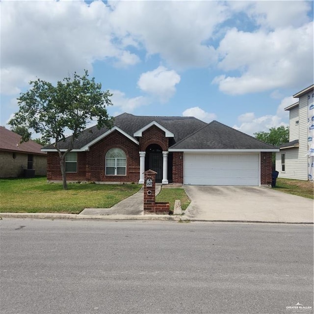 ranch-style home with a front yard and a garage