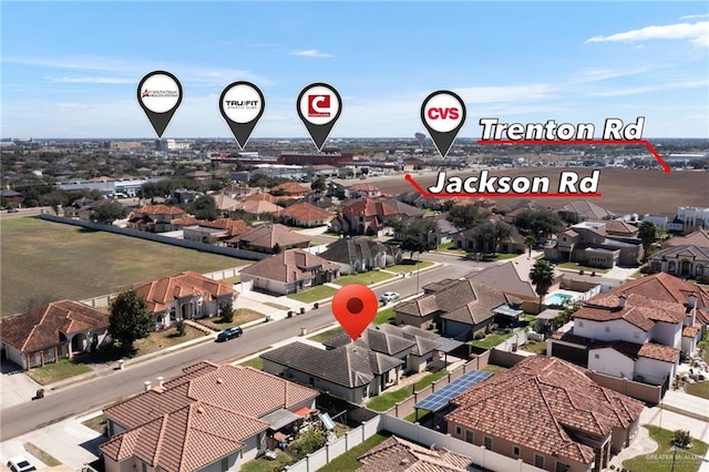birds eye view of property with a residential view