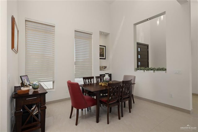 dining space featuring baseboards