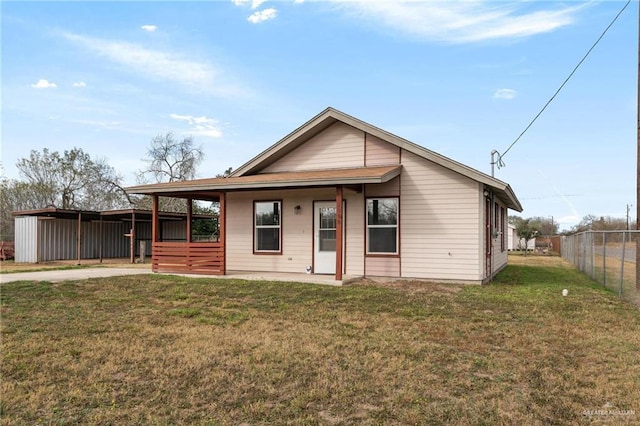 view of front facade with covered porch and a front yard