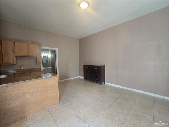 407 E Esperanza Ave, Mission, TX 78574 - kitchen featuring light tile patterned flooring and baseboards