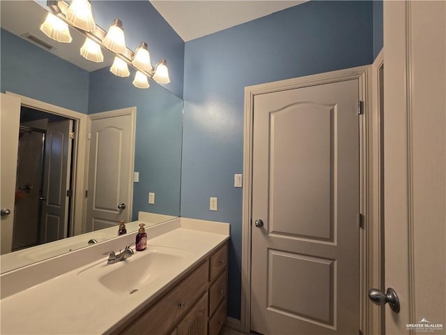 407 E Esperanza Ave, Mission, TX 78574 - bathroom featuring vanity and a chandelier