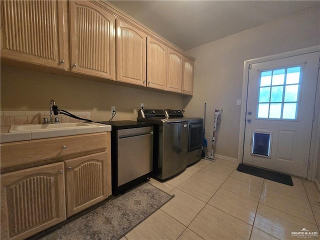 407 E Esperanza Ave, Mission, TX 78574 - laundry area featuring cabinet space, washer and clothes dryer, and light tile patterned floors